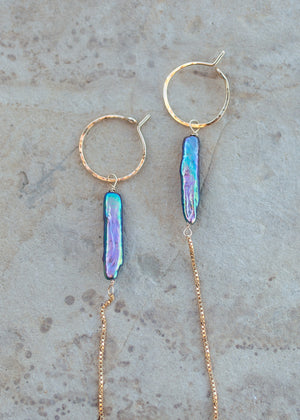 Close up of the peacock blue earrings