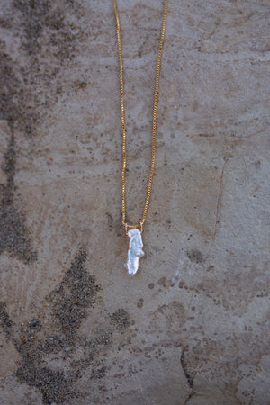 A single pearl necklace showing how the pearl pendant hangs from the chain