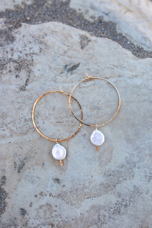 Another view of the hoops with white coin pearls showing hammered gold texture