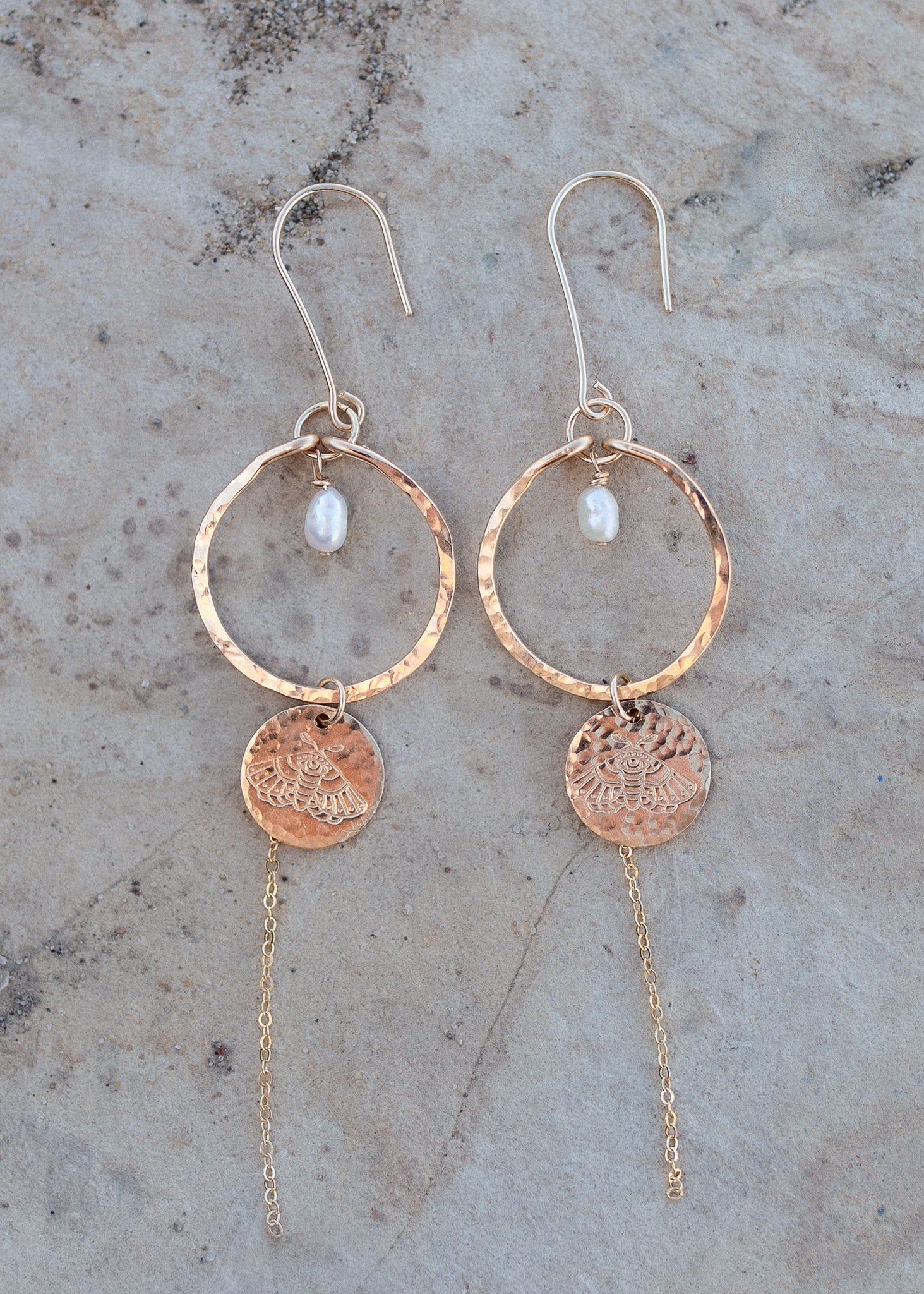 Close up of the white pearl Mira earrings