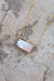 Close up of the mother of pearl pendant and box chain