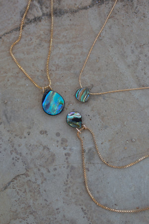 Three iridescent blue/green abalone necklaces with 14k gold chains.