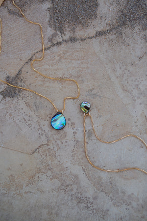 Two examples of the venetian box chain variants, one with a bigger teardrop abalone pendant and one with a smaller teardrop abalone pendant.